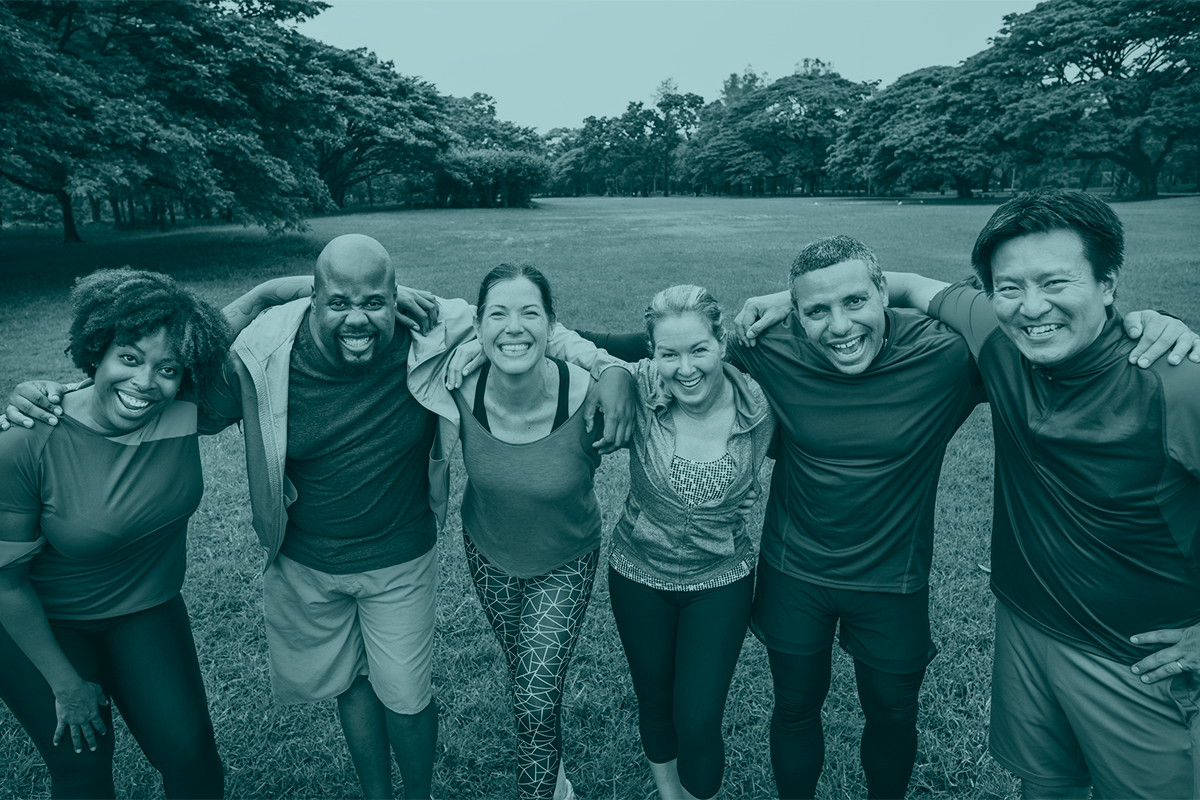 Banner for B Well Health Coaching. Image of a group of happy people outdoors wearing activewear.